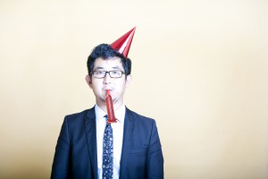 business man wearing party hat
